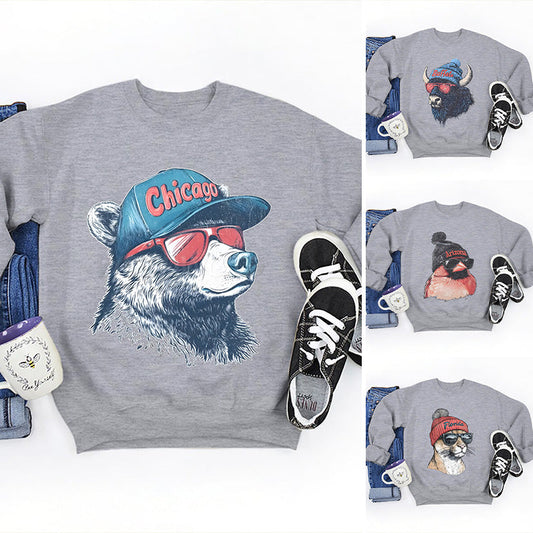 Stilren unisex-topp med djurmönstrad design och långa ärmar